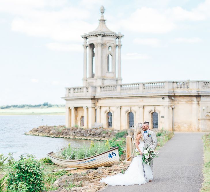 Bride in Pronovias Wedding Dress | Groom in Cream Herringbone Tweed Suit from Marc Darcy | Normanton Church on Rutland Water | White Stag Wedding Photography