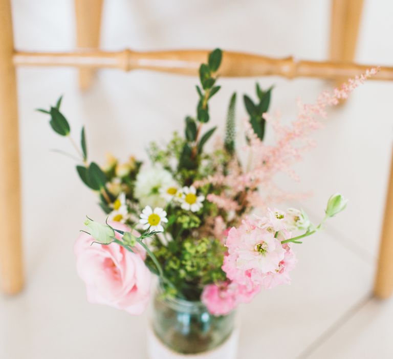 Pink Flower Stems in a Jam Jar as Aisle Flowers