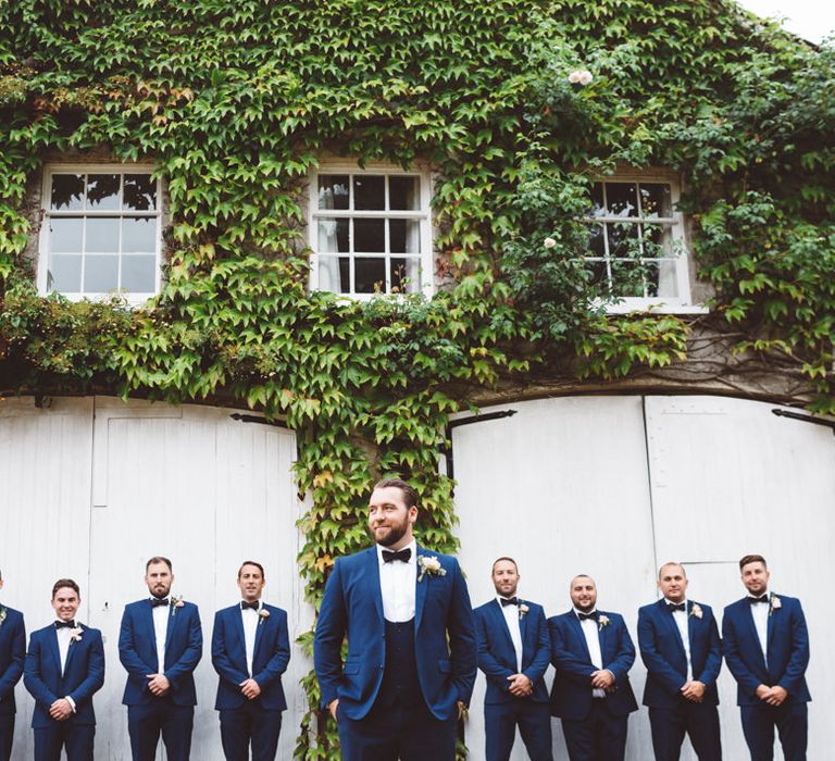 Groomsmen in Navy Suits & Bow Ties