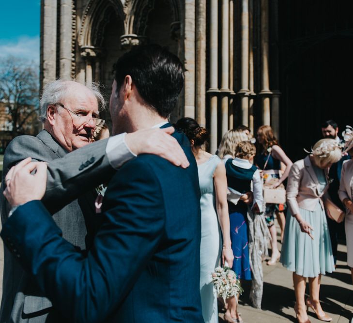 Church Courtyard | Groom in Next Suit | Classic Marquee Reception at Chippenham Park | Eliza Claire Photography