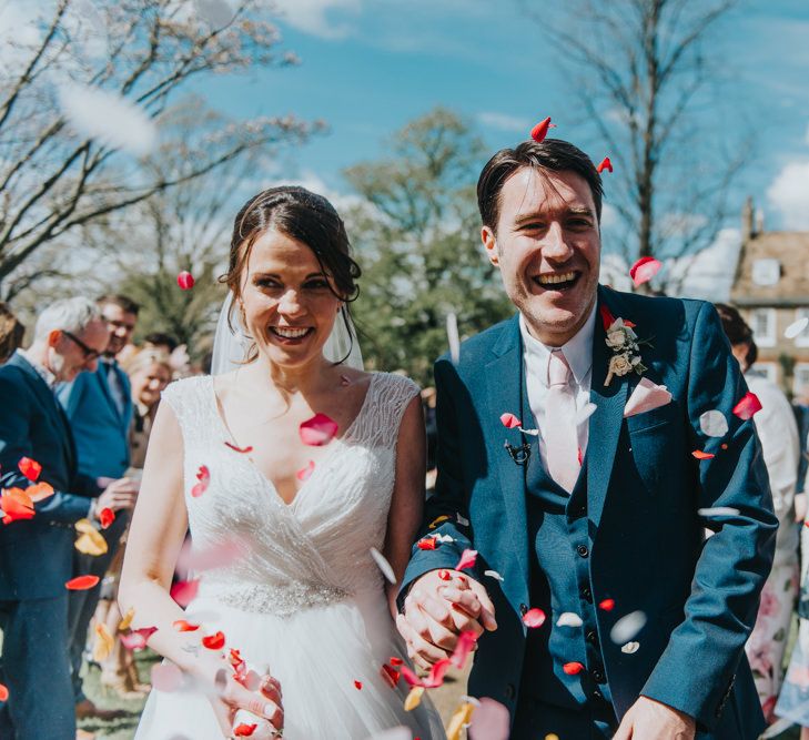 Confetti Moment | Bride in Sophia Tolli Gown | Groom in Next Suit | Classic Marquee Reception at Chippenham Park | Eliza Claire Photography