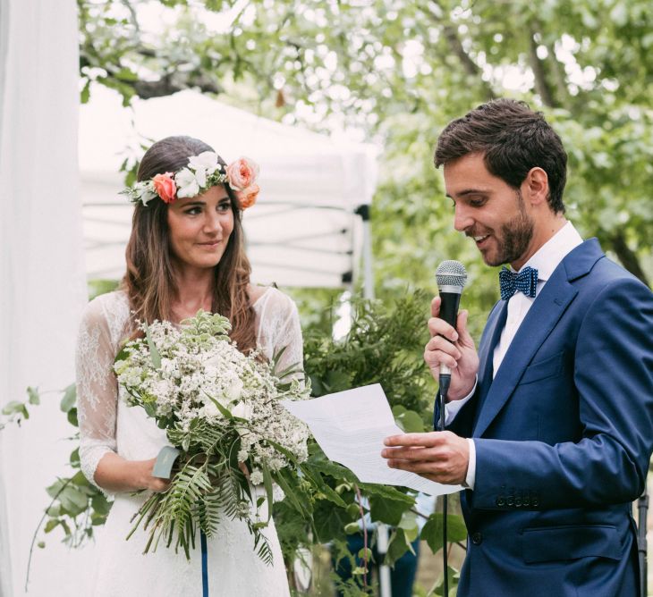 Spanish Outdoor Wedding Ceremony | Boho Bride in Veronica Miranda Bridal Separates & Flower Crown & Groom in Navy Suit & Bow Tie