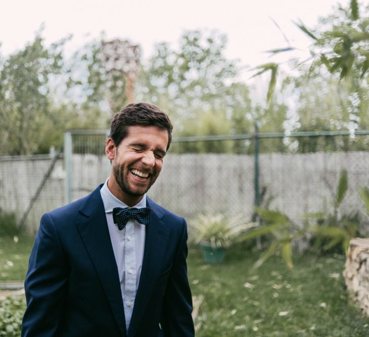 Dapper Groom in Suit & Bow Tie