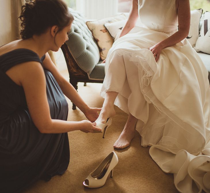 Bride in Tom Flowers Dress & Ivory & Co. Headdress Getting Ready