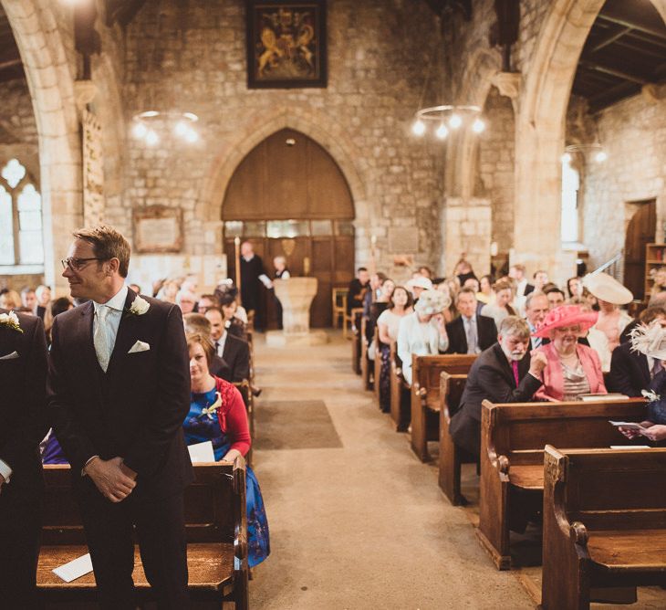 Groom in Moss Bros Suit at the Church Altar