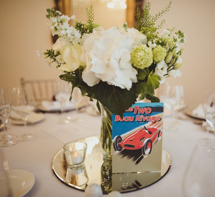 White Floral Centrepieces with Car Table Name