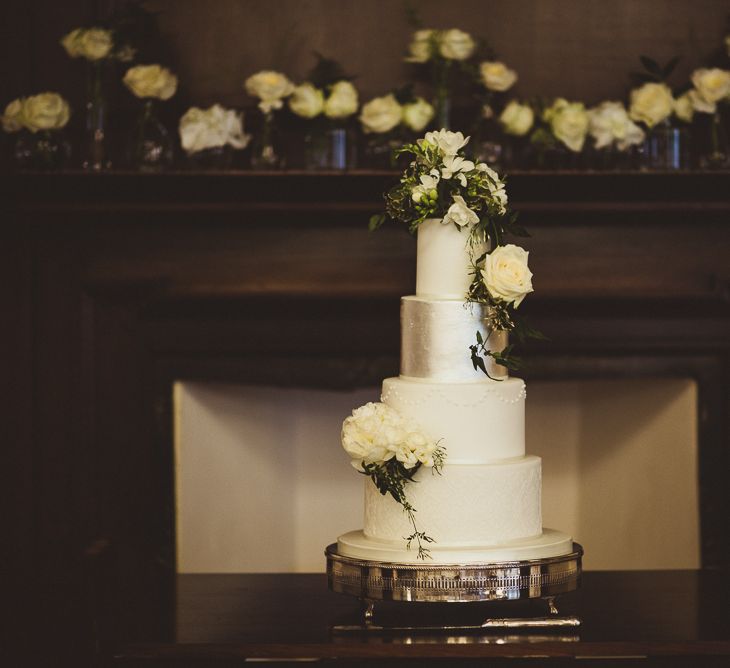 Four Tier Wedding Cake with Silver Layer & White Flowers