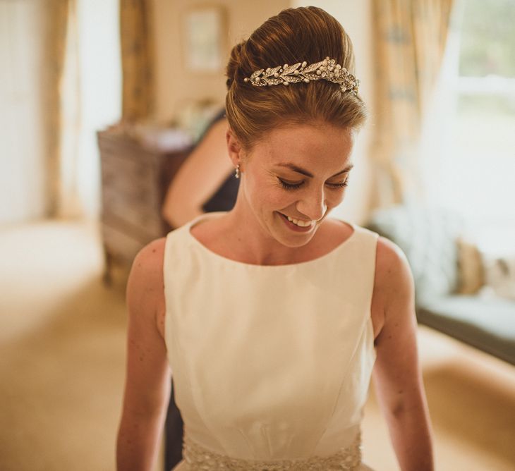 Bride in Tom Flowers Dress & Ivory & Co. Headdress Getting Ready