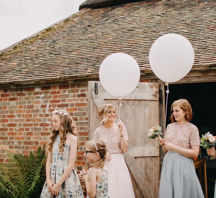 Bridesmaids With Balloons Wearing Coast