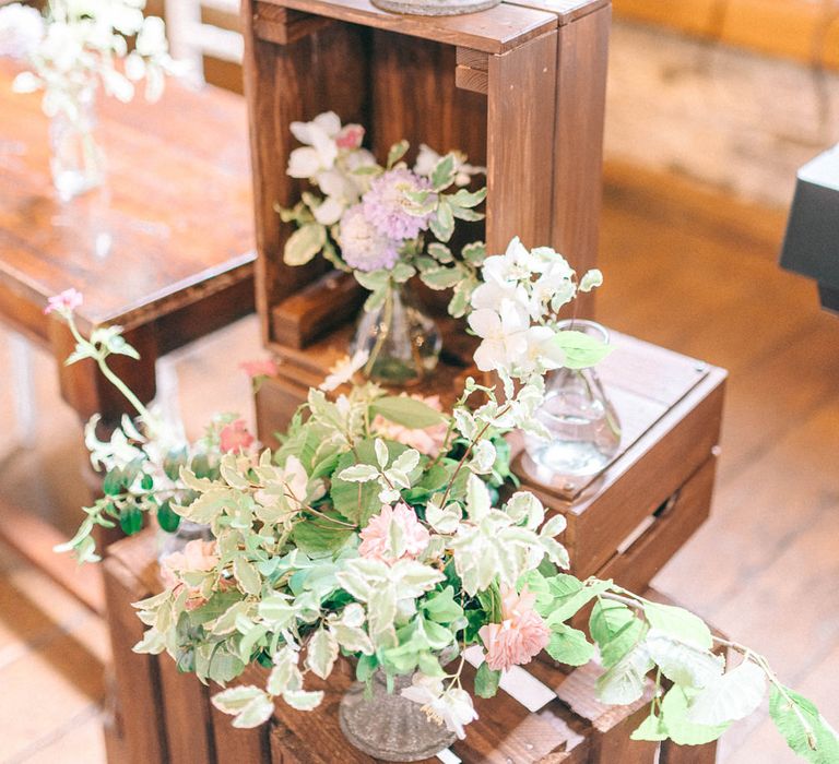 Wooden Crate & Flower Wedding Decor | Pastel Spring Wedding at Loseley Park Barn | Sarah-Jane Ethan Photography | Captured Media Weddings Film