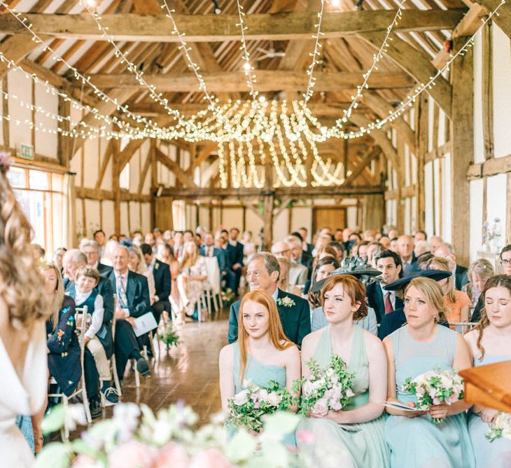 Wedding Ceremony | Bridesmaids in Pale Green & Blue Dresses | Pastel Spring Wedding at Loseley Park Barn | Sarah-Jane Ethan Photography | Captured Media Weddings Film