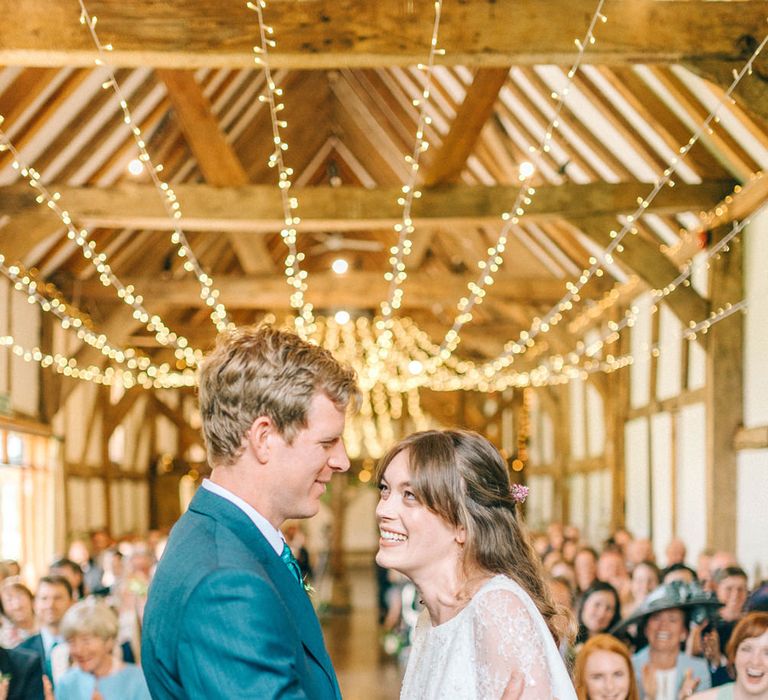 Wedding Ceremony | Bride in Fred & Ginger Bridal Design Gown | Groom in Navy Mullen Mullen Suit | Pastel Spring Wedding at Loseley Park Barn | Sarah-Jane Ethan Photography | Captured Media Weddings Film