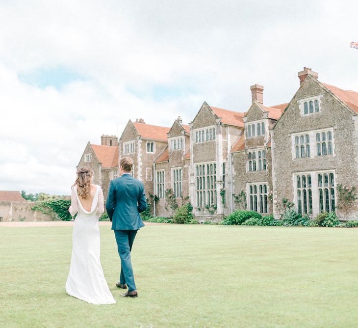 Bride in Fred & Ginger Bridal Design Gown | Groom in Navy Mullen Mullen Suit | Pastel Spring Wedding at Loseley Park Barn | Sarah-Jane Ethan Photography | Captured Media Weddings Film