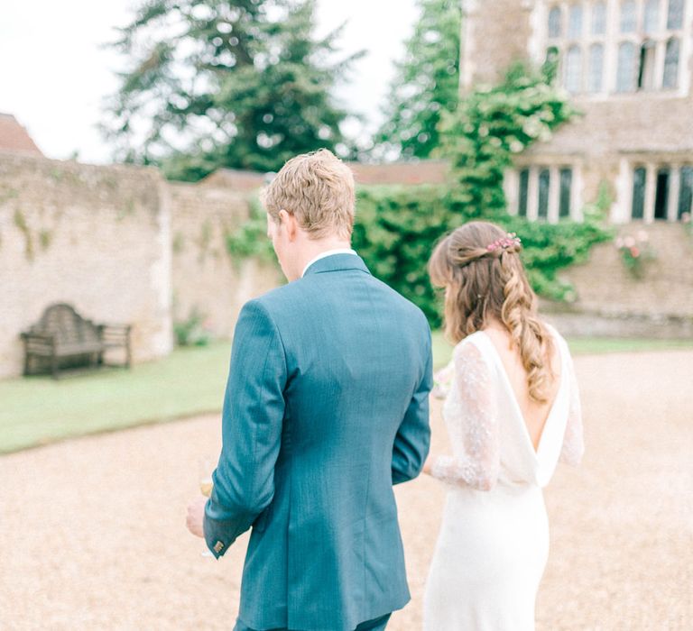 Bride in Fred & Ginger Bridal Design Gown | Groom in Navy Mullen Mullen Suit | Pastel Spring Wedding at Loseley Park Barn | Sarah-Jane Ethan Photography | Captured Media Weddings Film