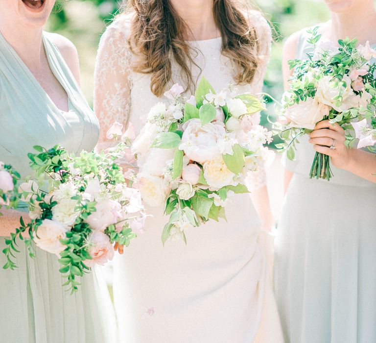 Romantic Peony & Foliage Bouquets | Bride in Fred & Ginger Bridal Design Gown | Bridesmaids in Pale Blue & Green Dresses | Pastel Spring Wedding at Loseley Park Barn | Sarah-Jane Ethan Photography | Captured Media Weddings Film