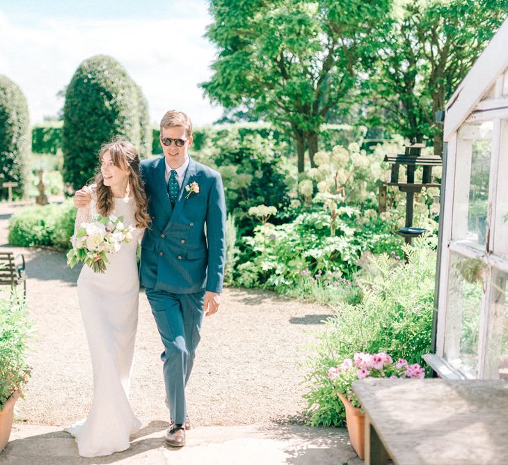 Bride in Fred & Ginger Bridal Design Gown | Groom in Navy Mullen & Mullen Suit | Pastel Spring Wedding at Loseley Park Barn | Sarah-Jane Ethan Photography | Captured Media Weddings Film