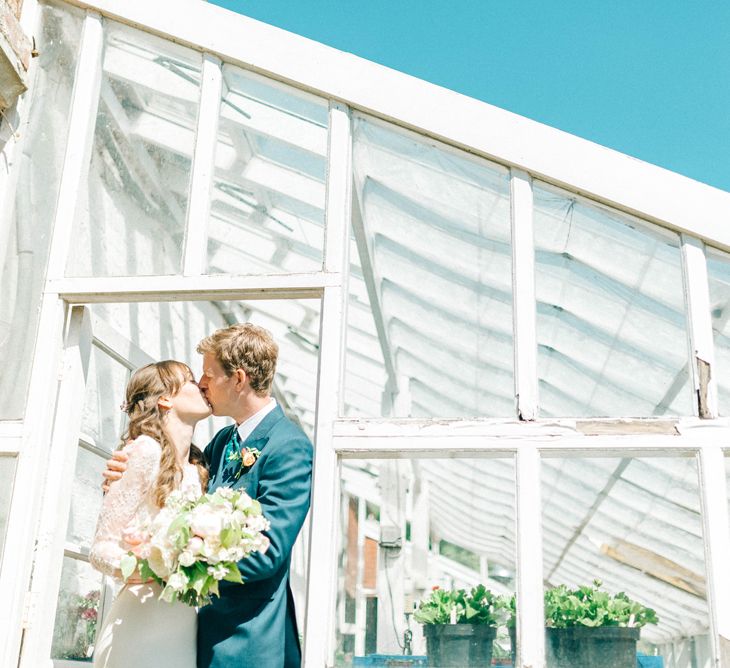 Bride in Fred & Ginger Bridal Design Gown | Groom in Navy Mullen & Mullen Suit | Pastel Spring Wedding at Loseley Park Barn | Sarah-Jane Ethan Photography | Captured Media Weddings Film