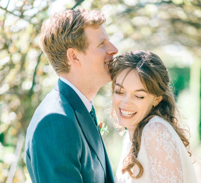 Bride in Fred & Ginger Bridal Design Gown | Groom in Navy Mullen & Mullen Suit | Pastel Spring Wedding at Loseley Park Barn | Sarah-Jane Ethan Photography | Captured Media Weddings Film