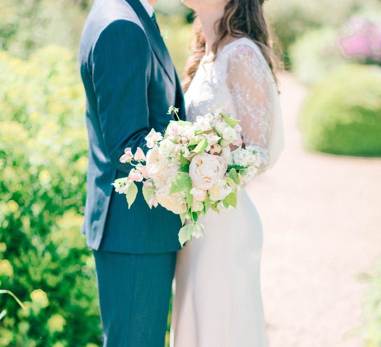 Romantic White Peony & Foliage Bouquet | Bride in Fred & Ginger Bridal Design Gown | Groom in Navy Mullen & Mullen Suit | Pastel Spring Wedding at Loseley Park Barn | Sarah-Jane Ethan Photography | Captured Media Weddings Film