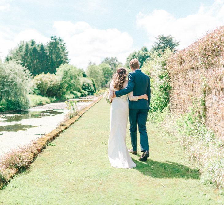 Bride in Fred & Ginger Bridal Design Gown | Groom in Navy Mullen & Mullen Suit | Pastel Spring Wedding at Loseley Park Barn | Sarah-Jane Ethan Photography | Captured Media Weddings Film