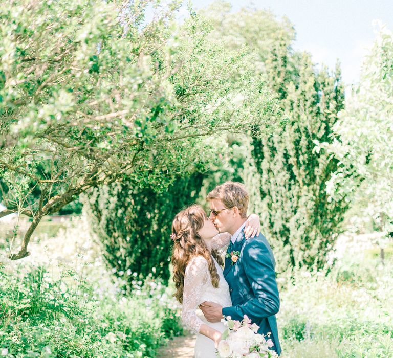 Bride in Fred & Ginger Bridal Design Gown | Groom in Navy Mullen & Mullen Suit | Pastel Spring Wedding at Loseley Park Barn | Sarah-Jane Ethan Photography | Captured Media Weddings Film