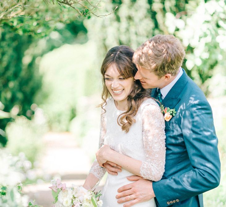 Bride in Fred & Ginger Bridal Design Gown | Groom in Navy Mullen & Mullen Suit | Pastel Spring Wedding at Loseley Park Barn | Sarah-Jane Ethan Photography | Captured Media Weddings Film