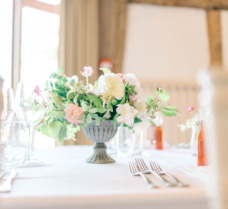 Floral Centrepiece | Pastel Spring Wedding at Loseley Park Barn | Sarah-Jane Ethan Photography | Captured Media Weddings Film