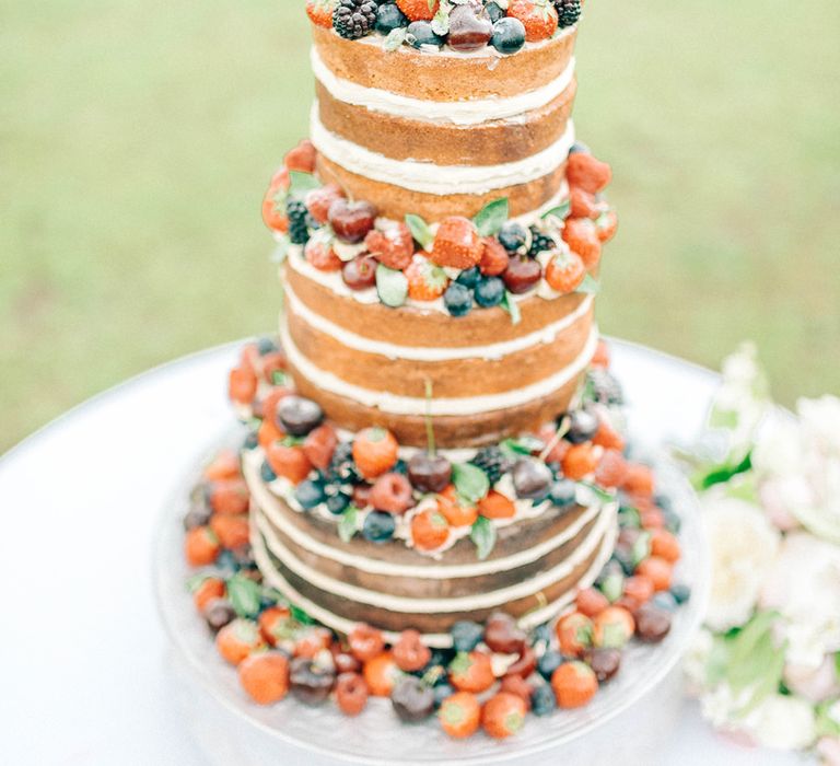 Naked Wedding Cake with Fruit | Pastel Spring Wedding at Loseley Park Barn | Sarah-Jane Ethan Photography | Captured Media Weddings Film