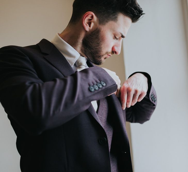 Groom Getting Ready For Winter Wedding