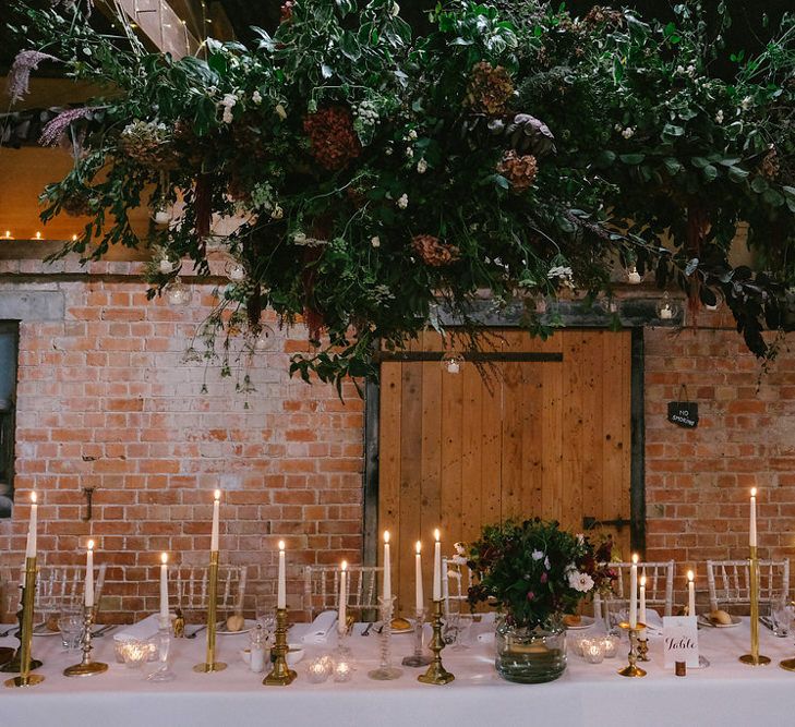 Top Table with Floral Hanging Installation & Candlelight | Natalie Hewitt Planned Wedding at Normanton Church & Kingsthorpe Lodge Barn | Jeni Smith Photography | Blue Ridge Wedding Videography