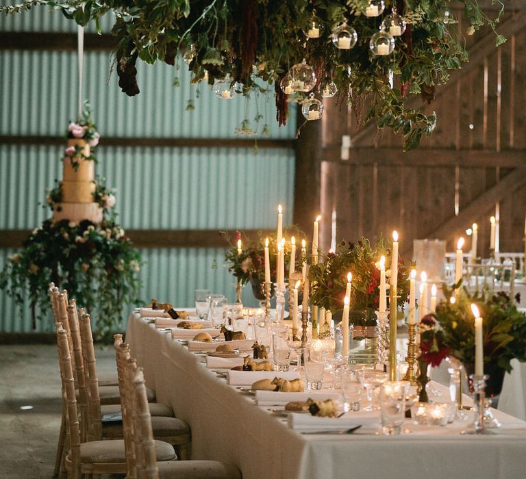 Hanging Floral Installation | Candle Light Wedding Decor | Natalie Hewitt Planned Wedding at Normanton Church & Kingsthorpe Lodge Barn | Jeni Smith Photography | Blue Ridge Wedding Videography