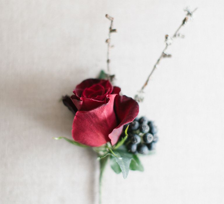 Red Buttonhole For Winter Wedding