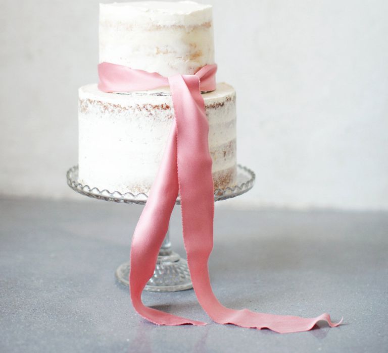 Semi Naked Wedding Cake With Pink Ribbon