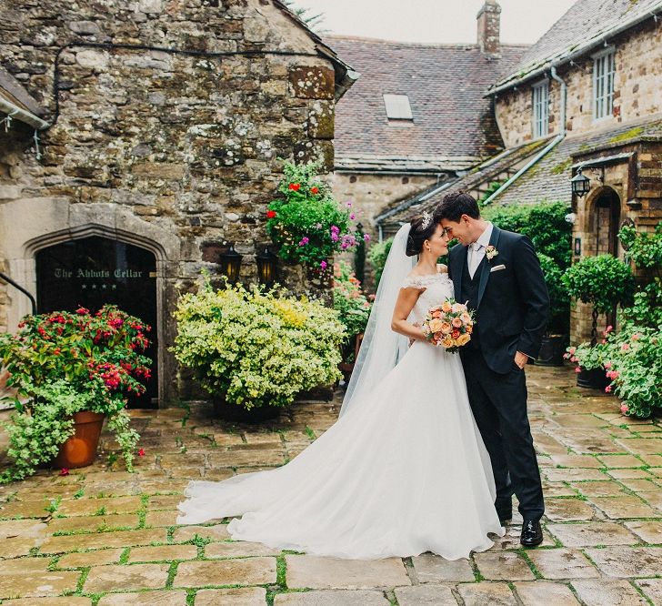 Bride in Suzanne Neville Heather Wedding Dress | Groom in Tuxedo | Coral & Green Wedding at The Italian Villa in Poole, Dorset with Japanese Gardens | Peppermint Love Photography | Wedding Memories Film