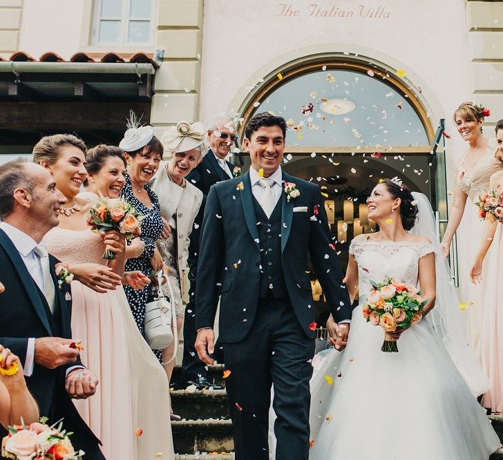 Confetti Moment | Bride in Suzanne Neville Heather Wedding Dress | Groom in Tuxedo | Coral & Green Wedding at The Italian Villa in Poole, Dorset with Japanese Gardens | Peppermint Love Photography | Wedding Memories Film