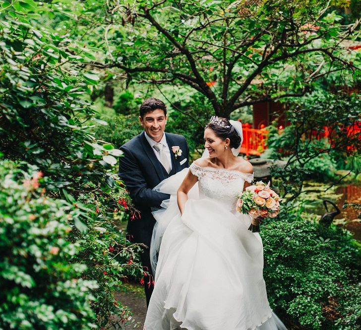 Bride in Suzanne Neville Heather Wedding Dress | Groom in Tuxedo | Coral & Green Wedding at The Italian Villa in Poole, Dorset with Japanese Gardens | Peppermint Love Photography | Wedding Memories Film