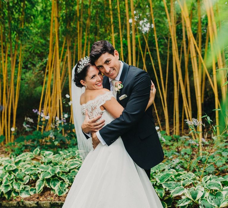 Bride in Suzanne Neville Heather Wedding Dress | Groom in Tuxedo | Coral & Green Wedding at The Italian Villa in Poole, Dorset with Japanese Gardens | Peppermint Love Photography | Wedding Memories Film