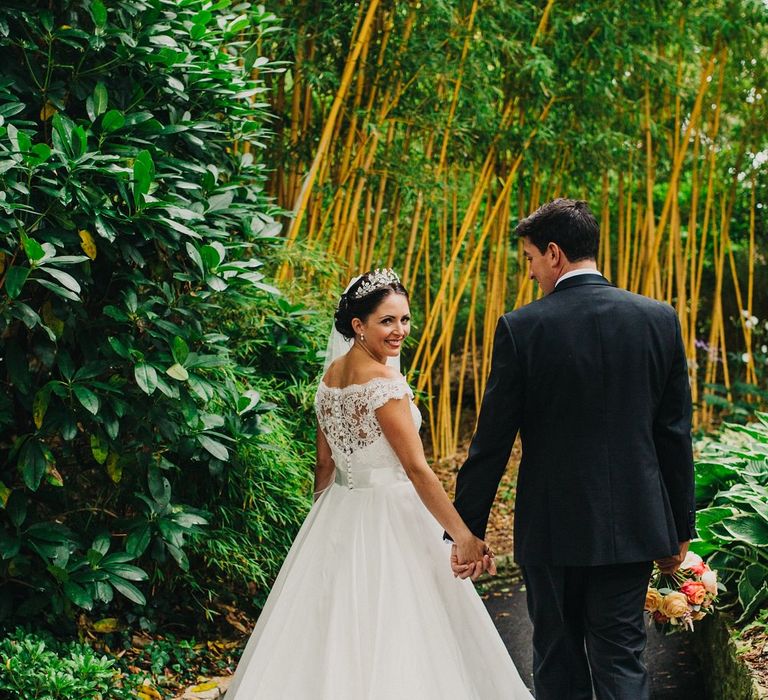 Bride in Suzanne Neville Heather Wedding Dress | Groom in Tuxedo | Coral & Green Wedding at The Italian Villa in Poole, Dorset with Japanese Gardens | Peppermint Love Photography | Wedding Memories Film