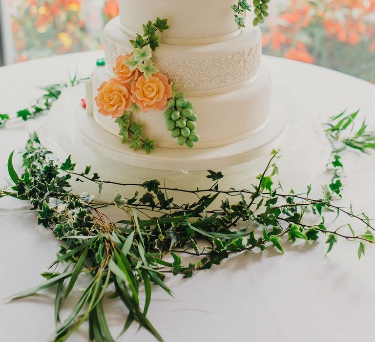 Sweetness & Delight Royal Icing Wedding Cake with Lego Decor | Bride in Suzanne Neville Heather Wedding Dress | Groom in Tuxedo | Bridesmaids in Nude More Lee Gowns | Coral & Green Wedding at The Italian Villa in Poole, Dorset with Japanese Gardens | Peppermint Love Photography | Wedding Memories Film