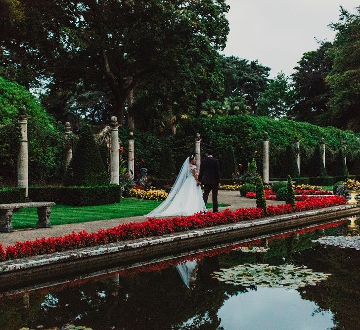 Bride in Suzanne Neville Heather Wedding Dress | Groom in Tuxedo | Coral & Green Wedding at The Italian Villa in Poole, Dorset with Japanese Gardens | Peppermint Love Photography | Wedding Memories Film