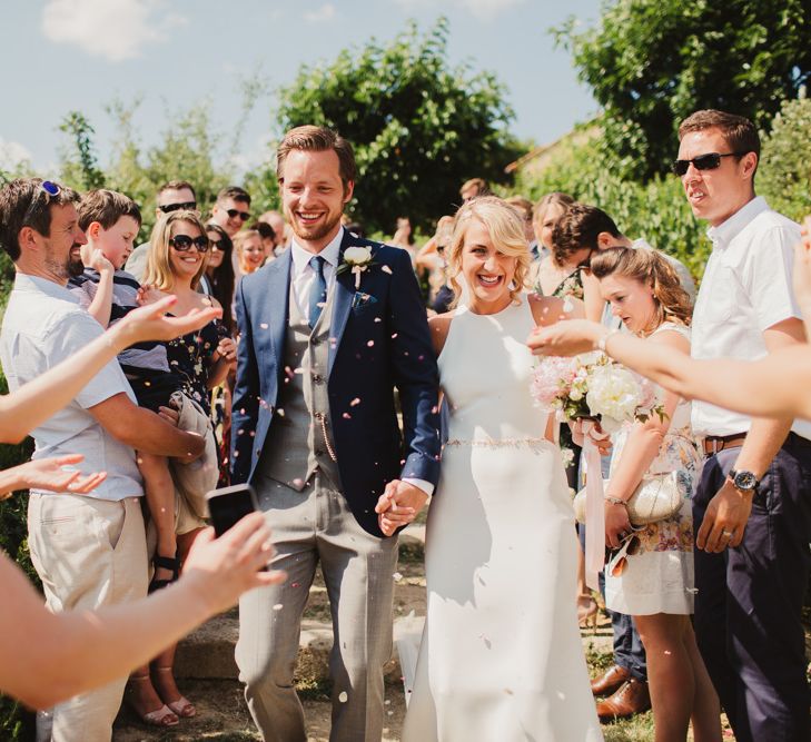 Confetti Moment | Bride in Sarah Seven Orleans Gown | Groom in Grey & Navy Suit | Frances Sales Photography