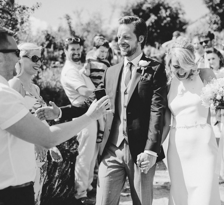 Confetti Moment | Bride in Sarah Seven Orleans Gown | Groom in Grey & Navy Suit | Frances Sales Photography