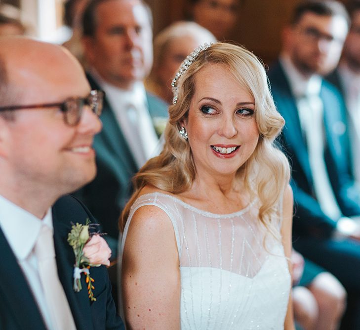 Bride in Rosa Clara Veleta Wedding Dress & Groom in Chester Barrie Suit