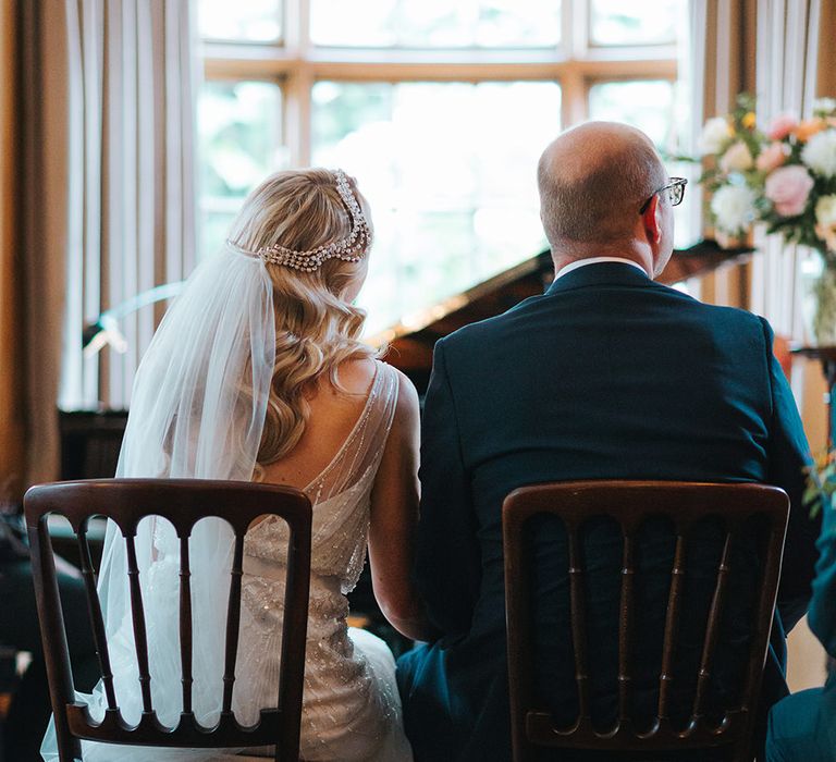 Bride in Rosa Clara Veleta Wedding Dress & Groom in Chester Barrie Suit