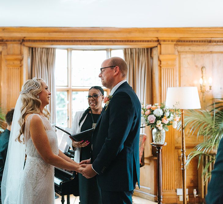 Bride in Rosa Clara Veleta Wedding Dress & Groom in Chester Barrie Suit