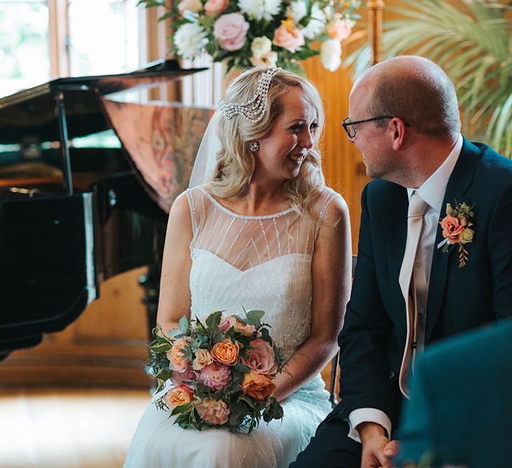 Bride in Rosa Clara Veleta Wedding Dress & Groom in Chester Barrie Suit