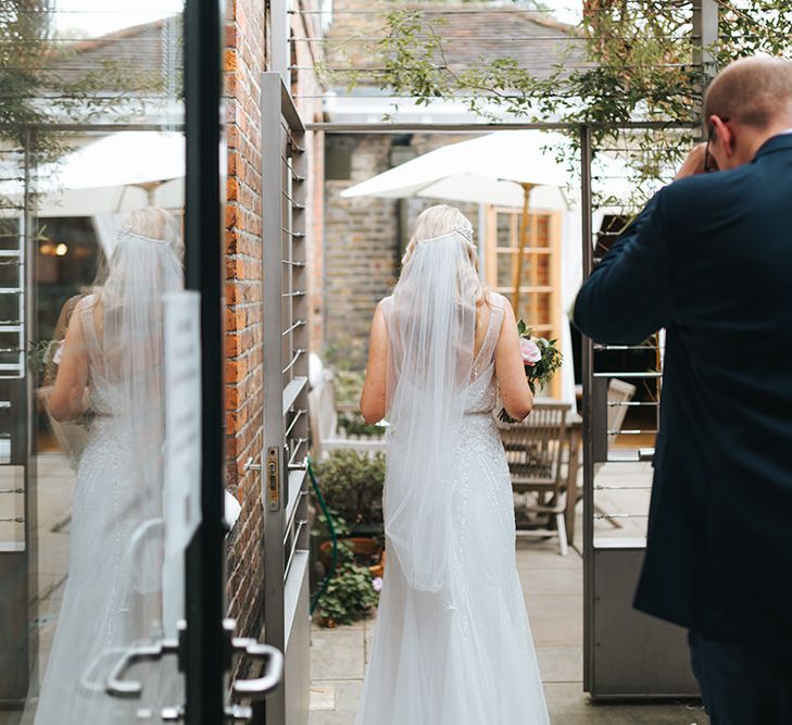 Bride in Rosa Clara Veleta Wedding Dress & Groom in Chester Barrie Suit