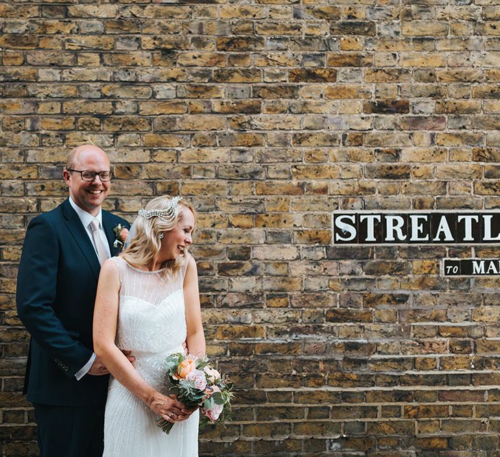 Bride in Rosa Clara Veleta Wedding Dress & Groom in Chester Barrie Suit