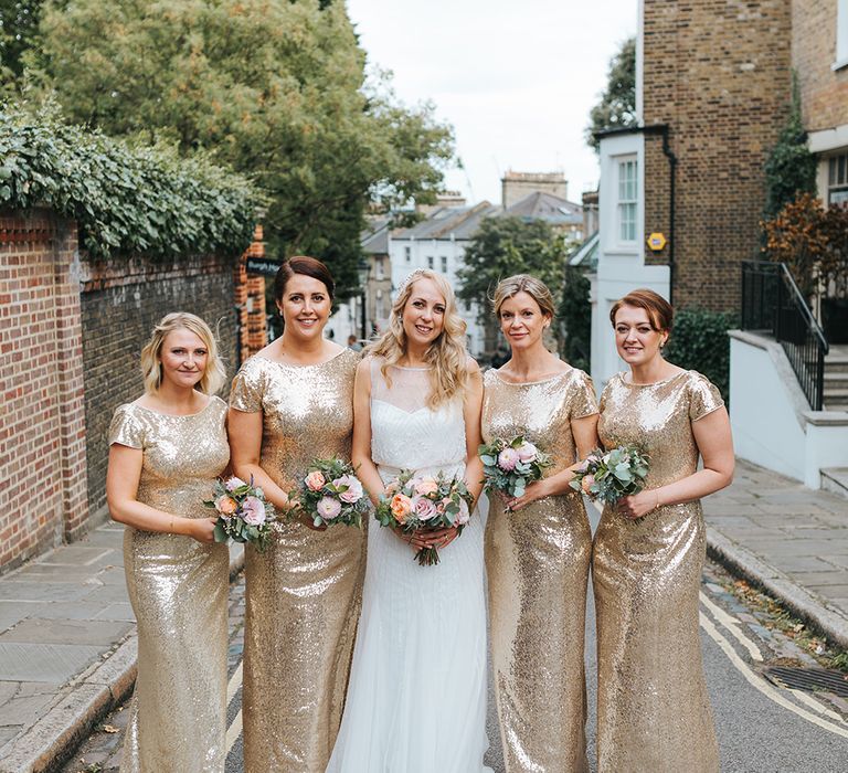 Bride in Rosa Clara Veleta Wedding Dress & Bridesmaids in Gold Sequin Dresses