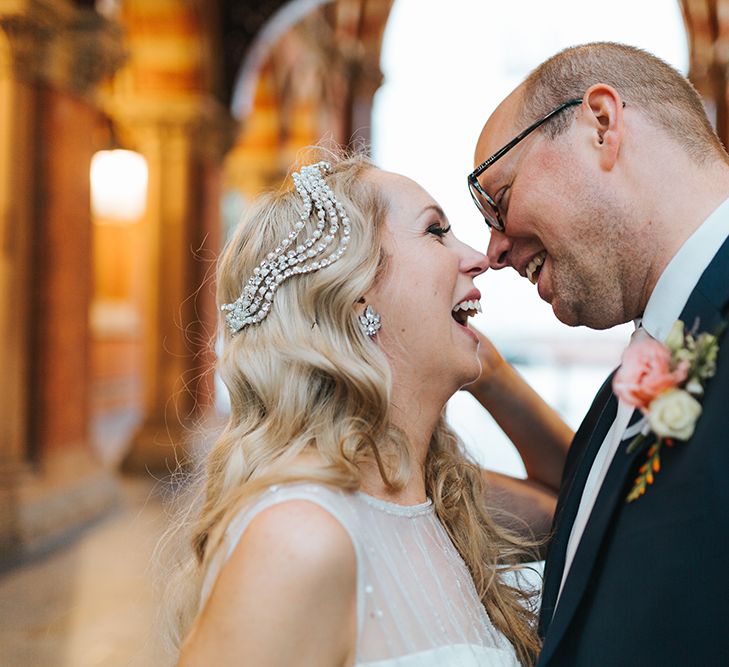 Bride in Rosa Clara Veleta Wedding Dress & Groom in Chester Barrie Suit